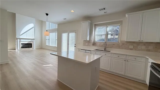 a bathroom with a toilet a sink and a mirror