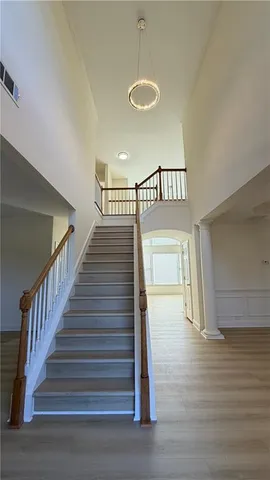 a view of staircase with white walls