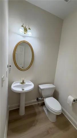 a view of an empty room and wooden floor