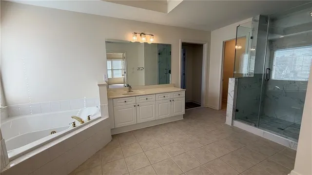 a view of an empty room and wooden floor