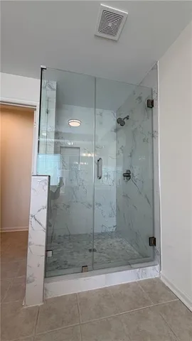 a backyard of a house with barbeque oven and outdoor seating