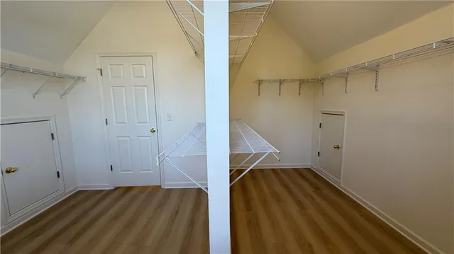 a view of a house with snow on the road