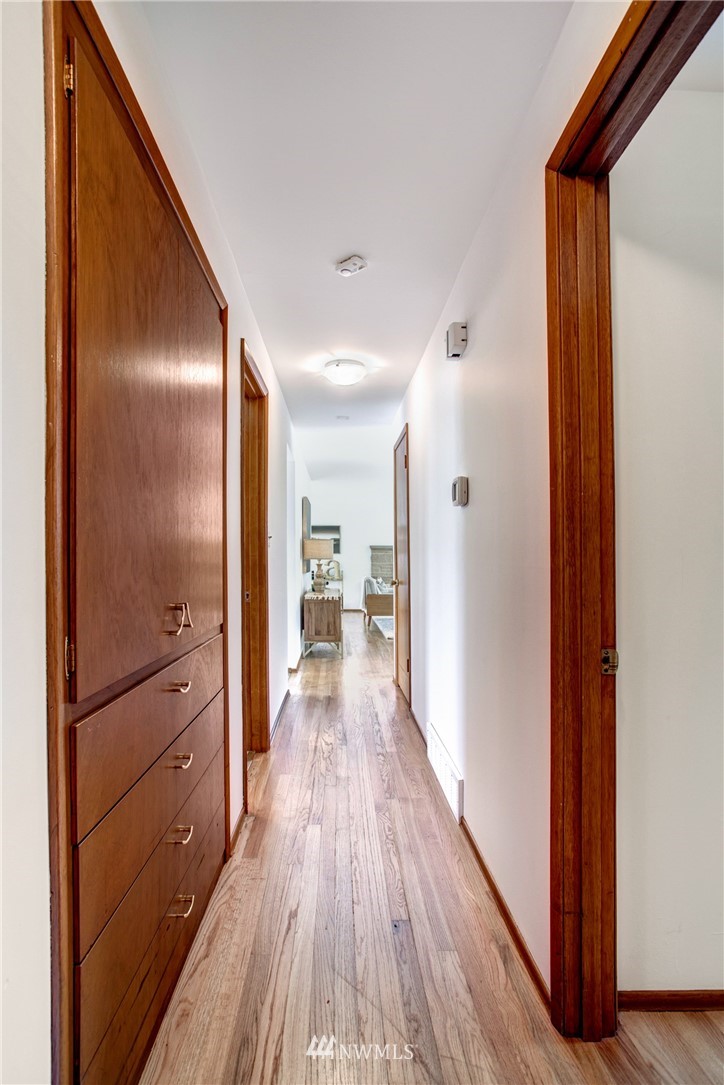 7620 South 115th Street Seattle, WA 98178 - Photo 21 of 33 a view of a hallway with wooden floor