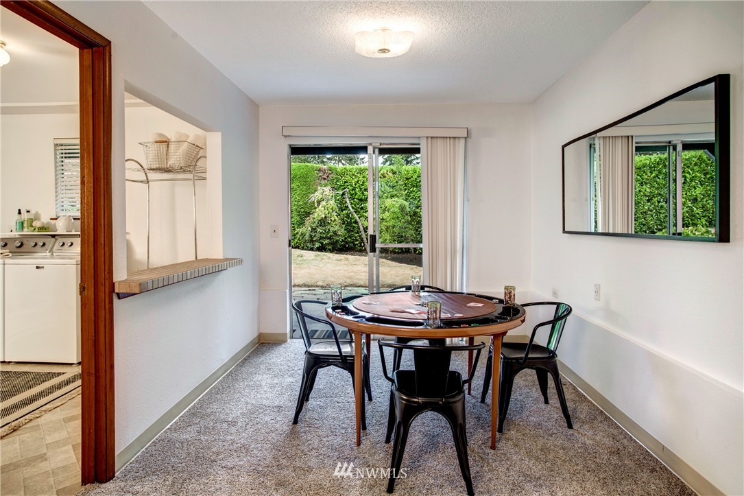 7620 South 115th Street Seattle, WA 98178 - Photo 23 of 33 a dining room with furniture and window