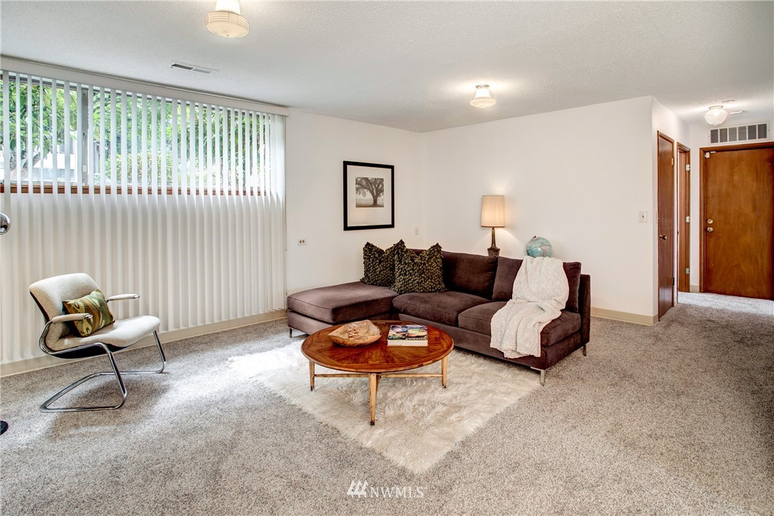 7620 South 115th Street Seattle, WA 98178 - Photo 25 of 33 a living room with furniture and a large window