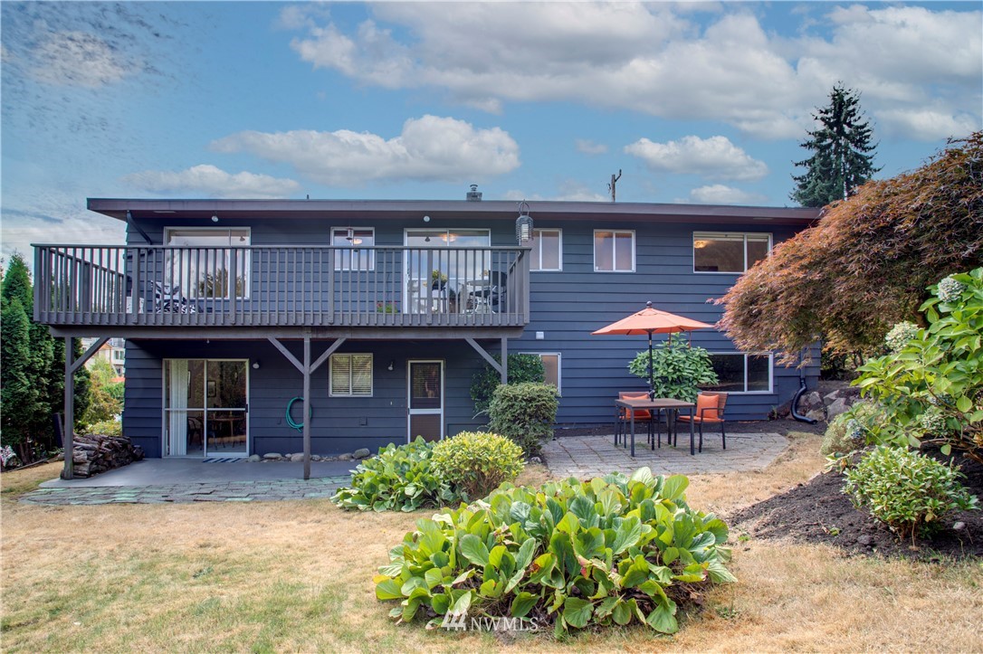 7620 South 115th Street Seattle, WA 98178 - Photo 29 of 33 a front view of a house with a garden and plants