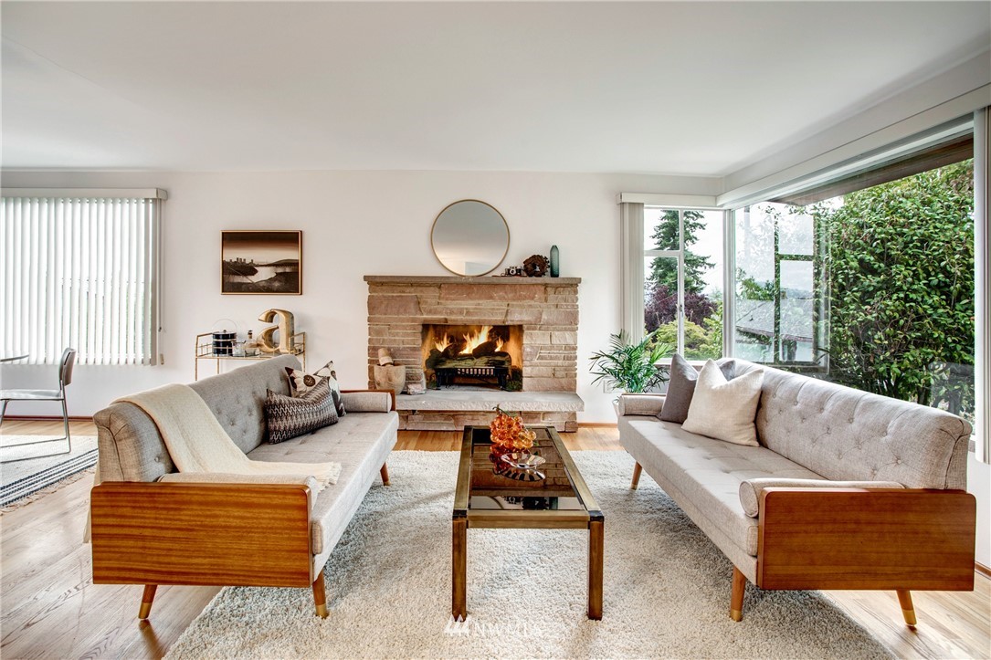 7620 South 115th Street Seattle, WA 98178 - Photo 4 of 33 a living room with furniture a large window and a fireplace