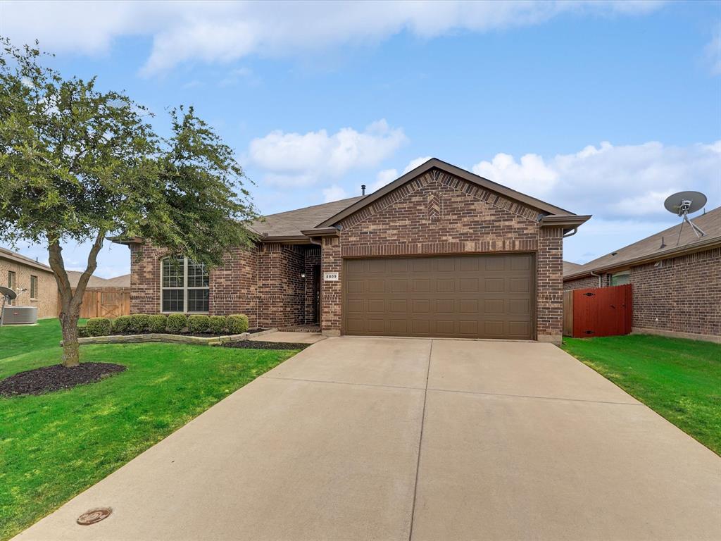 4809 Willow Branch Court Fort Worth, TX 76036 - Photo 1 of 1 a front view of a house with a yard and garage
