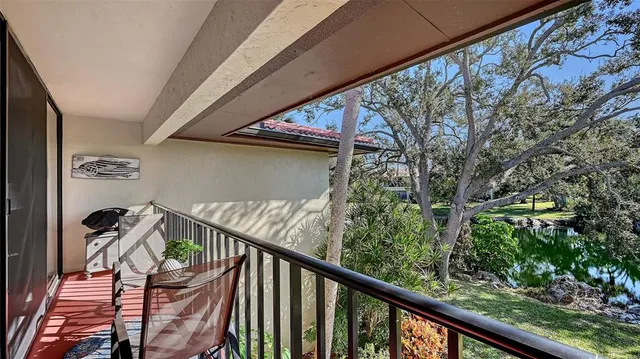 a view of balcony with wooden floor