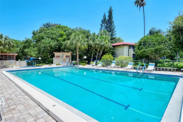 a view of a swimming pool with a patio
