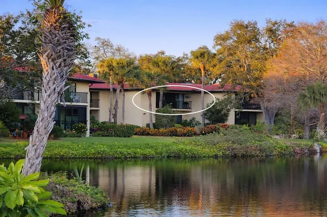 a front view of a house with a lake view