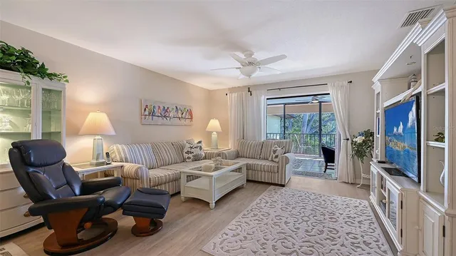 a living room with furniture or couch and a flat screen tv