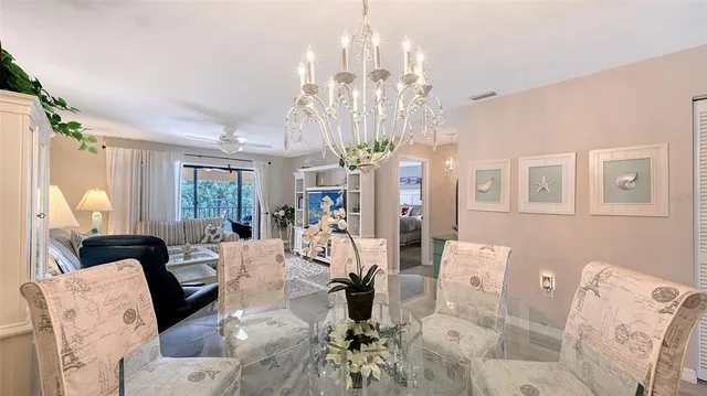 a living room with furniture a chandelier and a chandelier