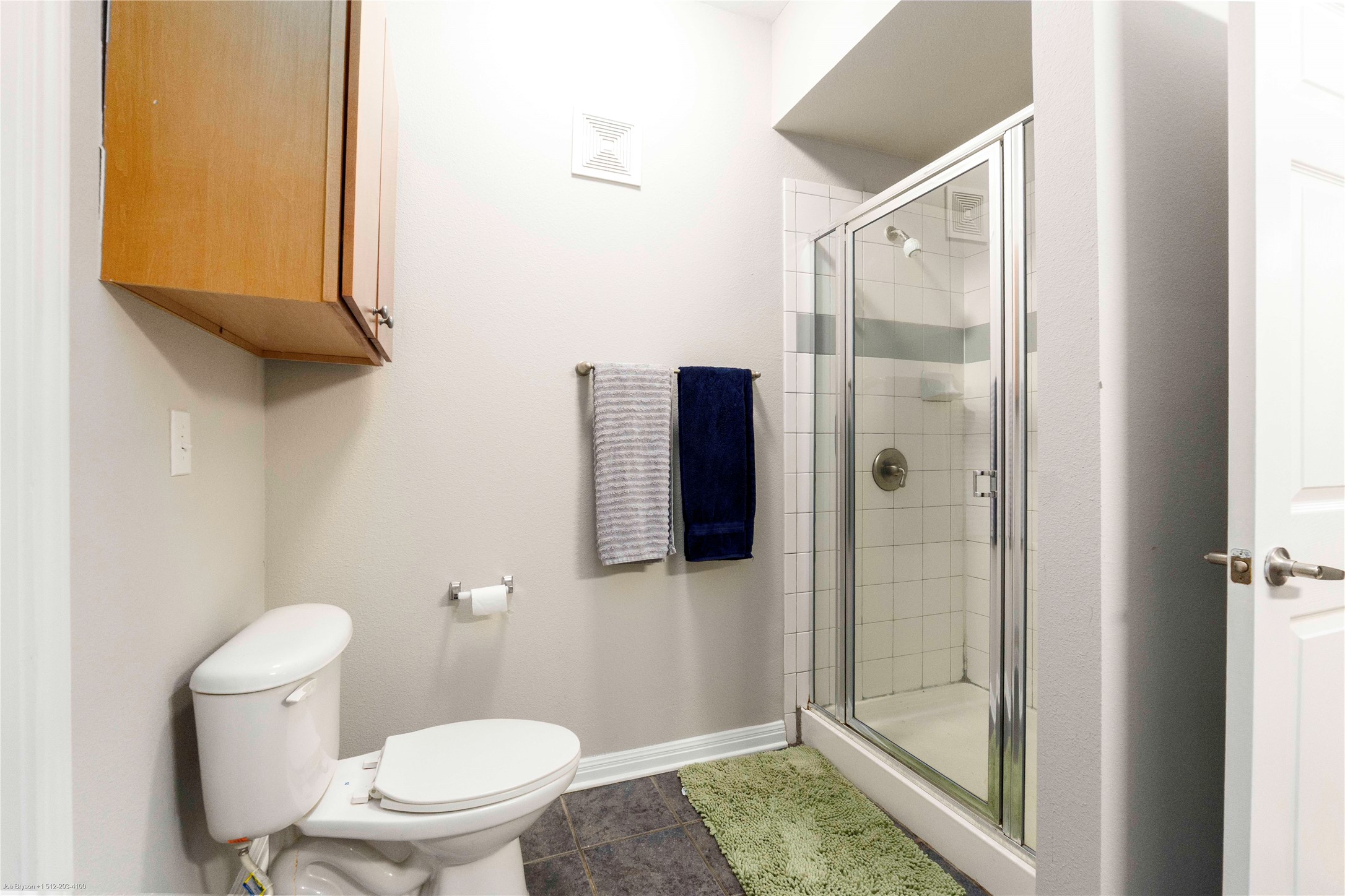 2502 Leon Street, Unit 305 Austin, TX 78705 - Photo 18 of 26 Full bathroom with a shower stall and tile patterned flooring