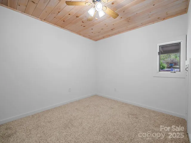 a wooden bench sitting in a room