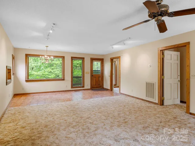 a view of a livingroom with a furniture and a fireplace