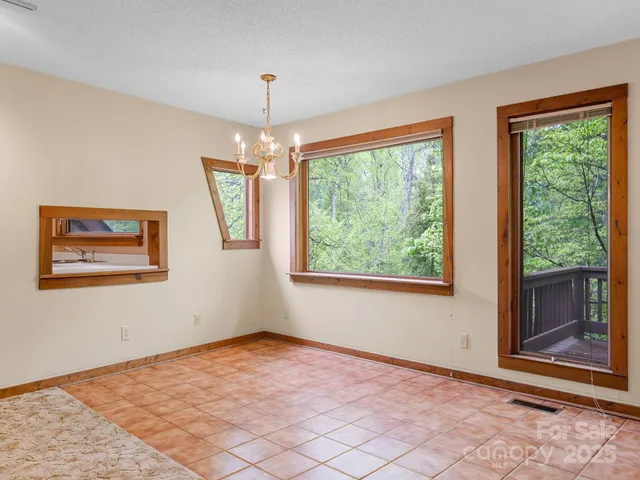 a kitchen with kitchen island a sink stove and refrigerator