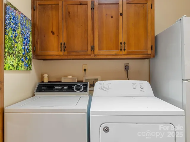 a bathroom with a granite countertop toilet sink and mirror