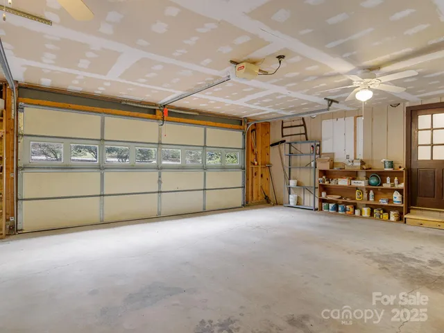 a room with table chairs and windows