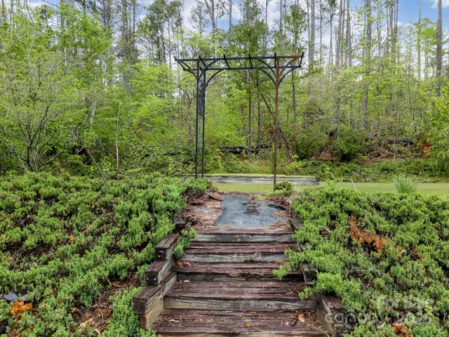 a view of field with trees in the background