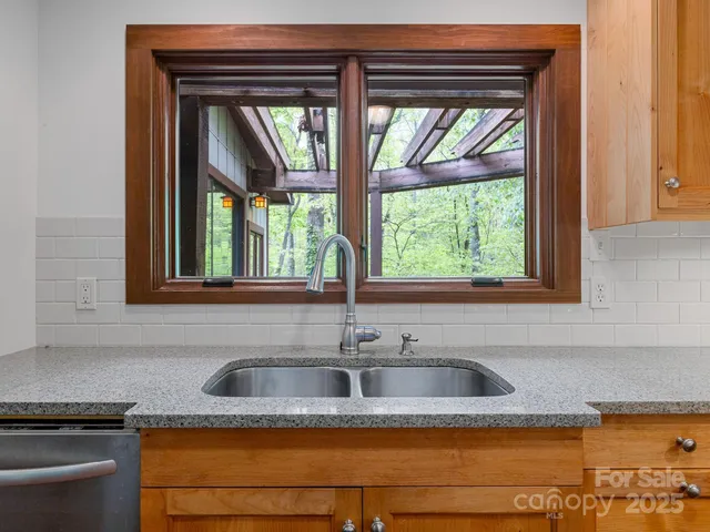 a kitchen sink sitting next to a window
