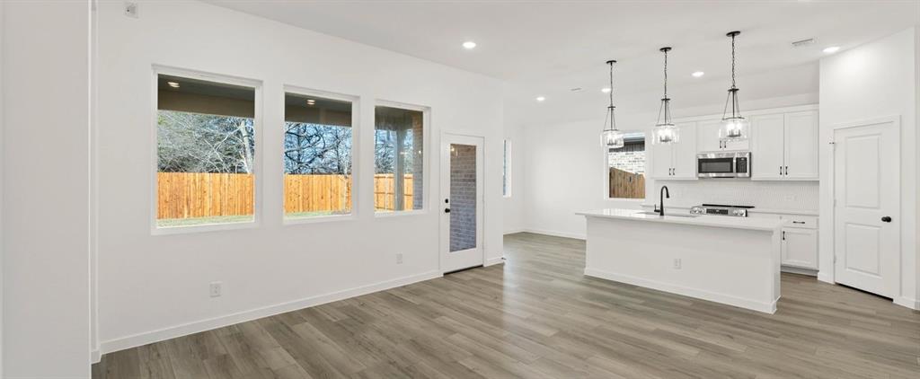 1018 Colgate Circle Princeton, TX 75407 - Photo 22 of 36 Open Kitchen-Living-Dining Room featuring the Harmony Collection
