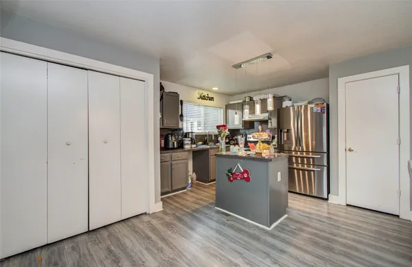 a kitchen with a refrigerator and a refrigerator