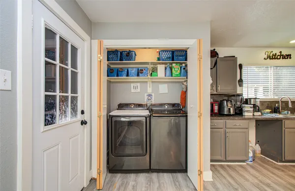 a kitchen with stainless steel appliances granite countertop a stove and a refrigerator