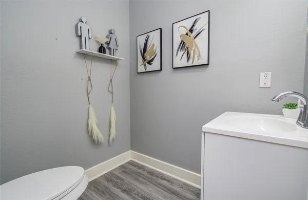 a bathroom with a toilet and a sink