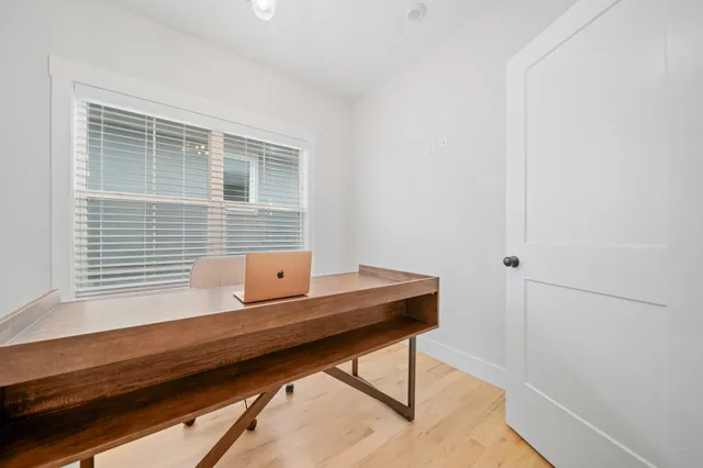 a view of workspace with wooden floor