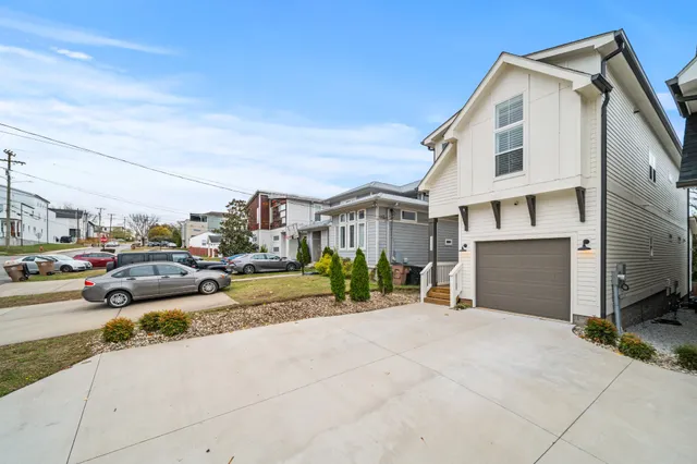 a view of a street with cars