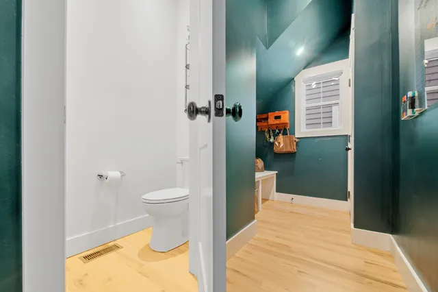 a bathroom with a toilet and a shower