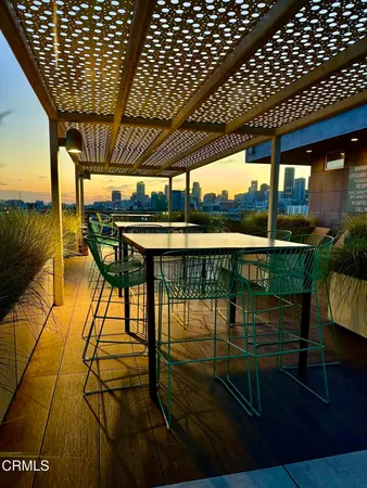 a view of a patio with couches and potted plants
