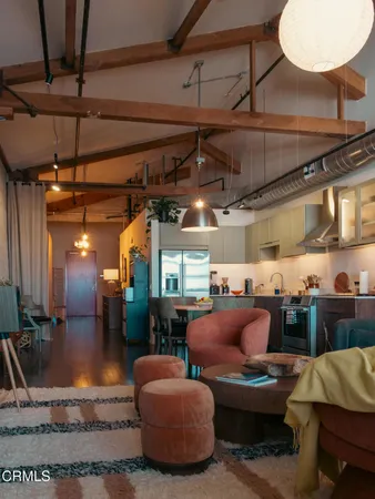 a living room with lots of furniture and a chandelier