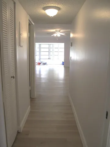 a view of hallway with natural light