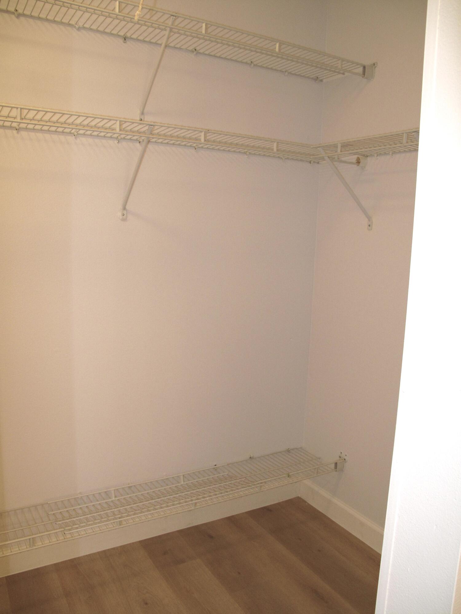 1102 North Drive, Unit C Delray Beach, FL 33445 - Photo 20 of 36 a view of a room with racks on the wall