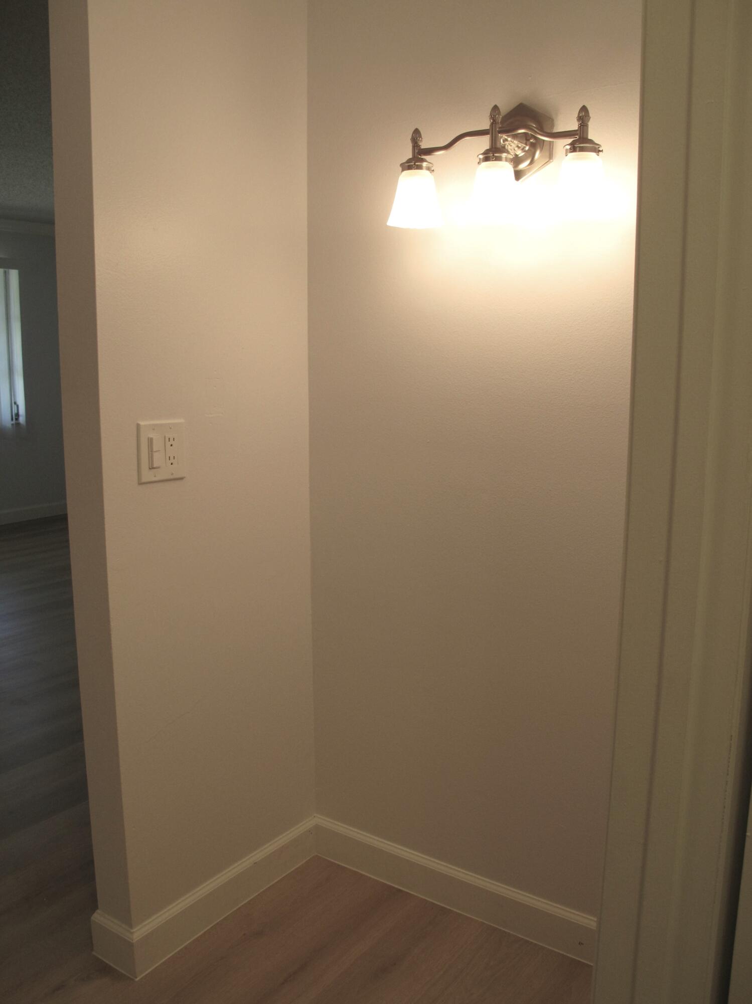 1102 North Drive, Unit C Delray Beach, FL 33445 - Photo 21 of 36 a bathroom with a window