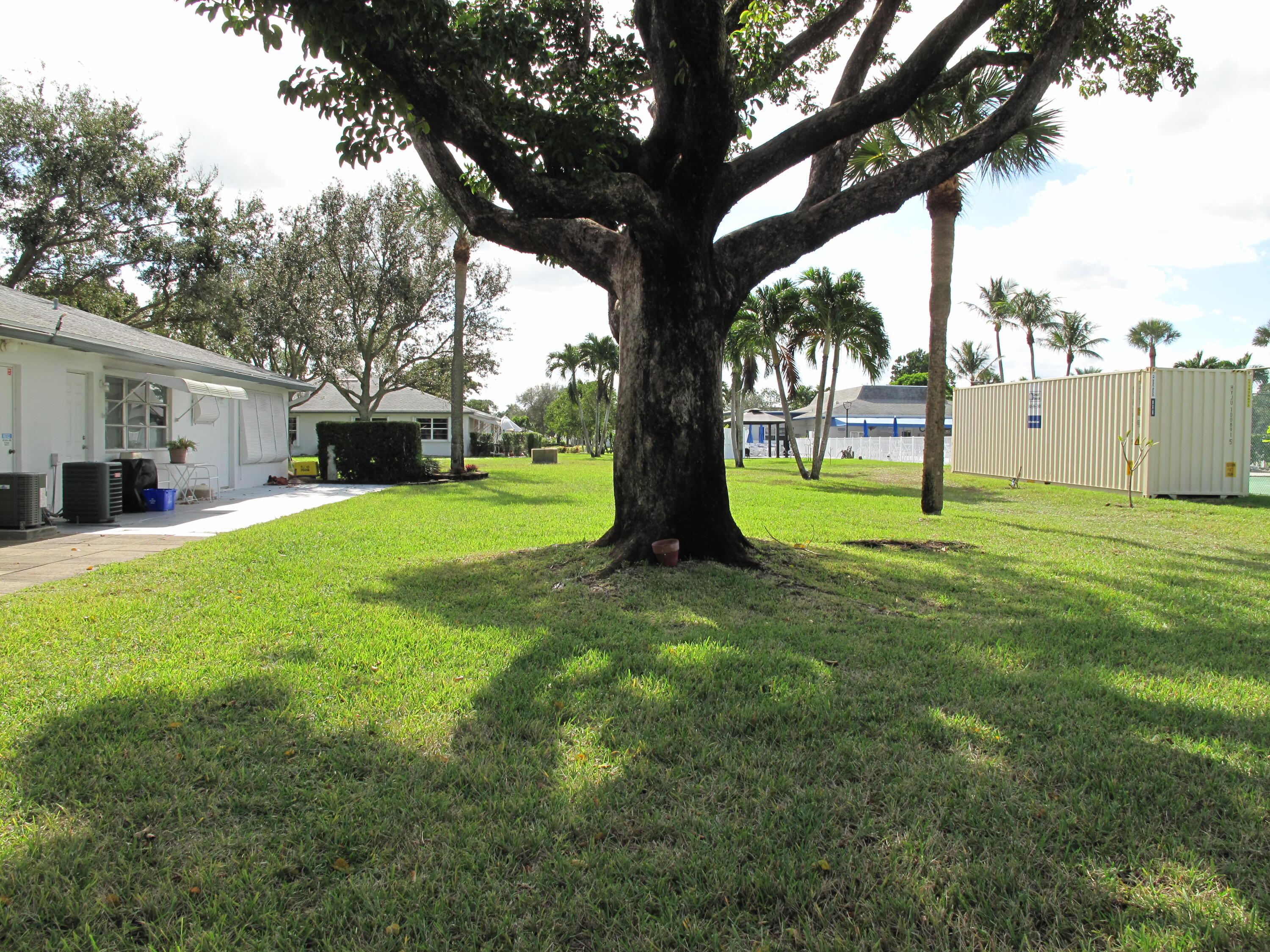 1102 North Drive, Unit C Delray Beach, FL 33445 - Photo 23 of 36 a view of a park with a tree