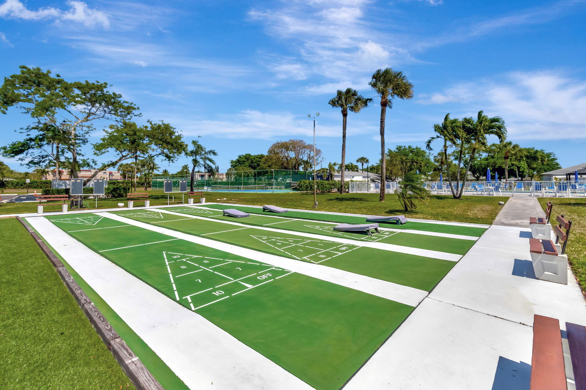 1102 North Drive, Unit C Delray Beach, FL 33445 - Photo 30 of 36 a view of a tennis court