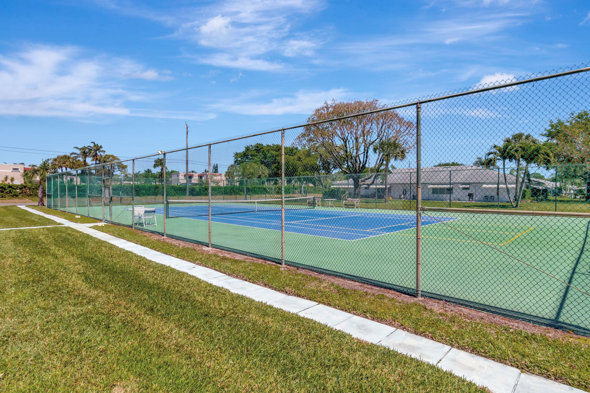 1102 North Drive, Unit C Delray Beach, FL 33445 - Photo 31 of 36 a view of a tennis court