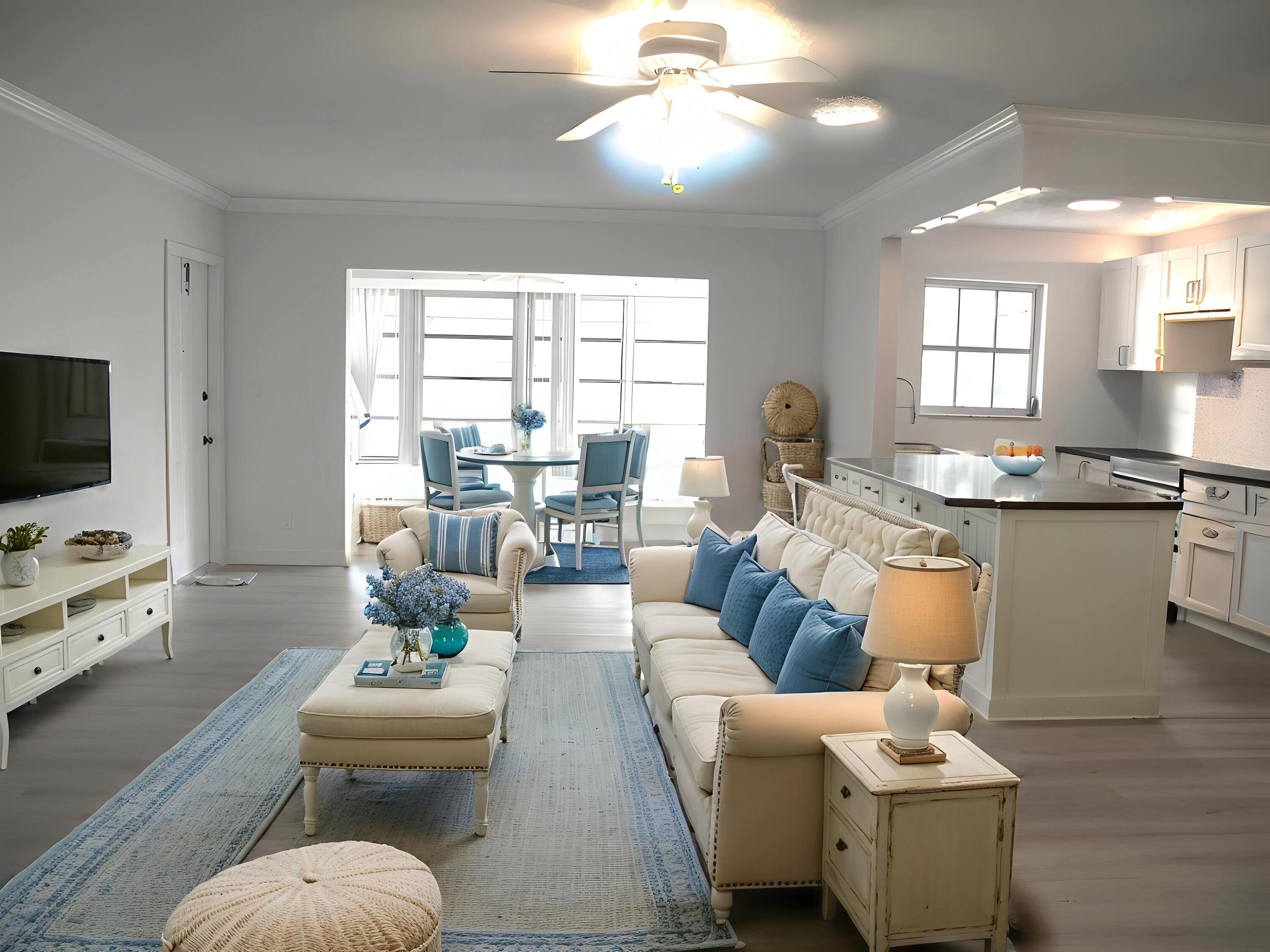 1102 North Drive, Unit C Delray Beach, FL 33445 - Photo 6 of 36 a living room with furniture and a flat screen tv