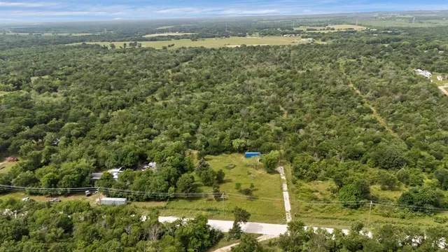 a view of a field with a mountain in the background