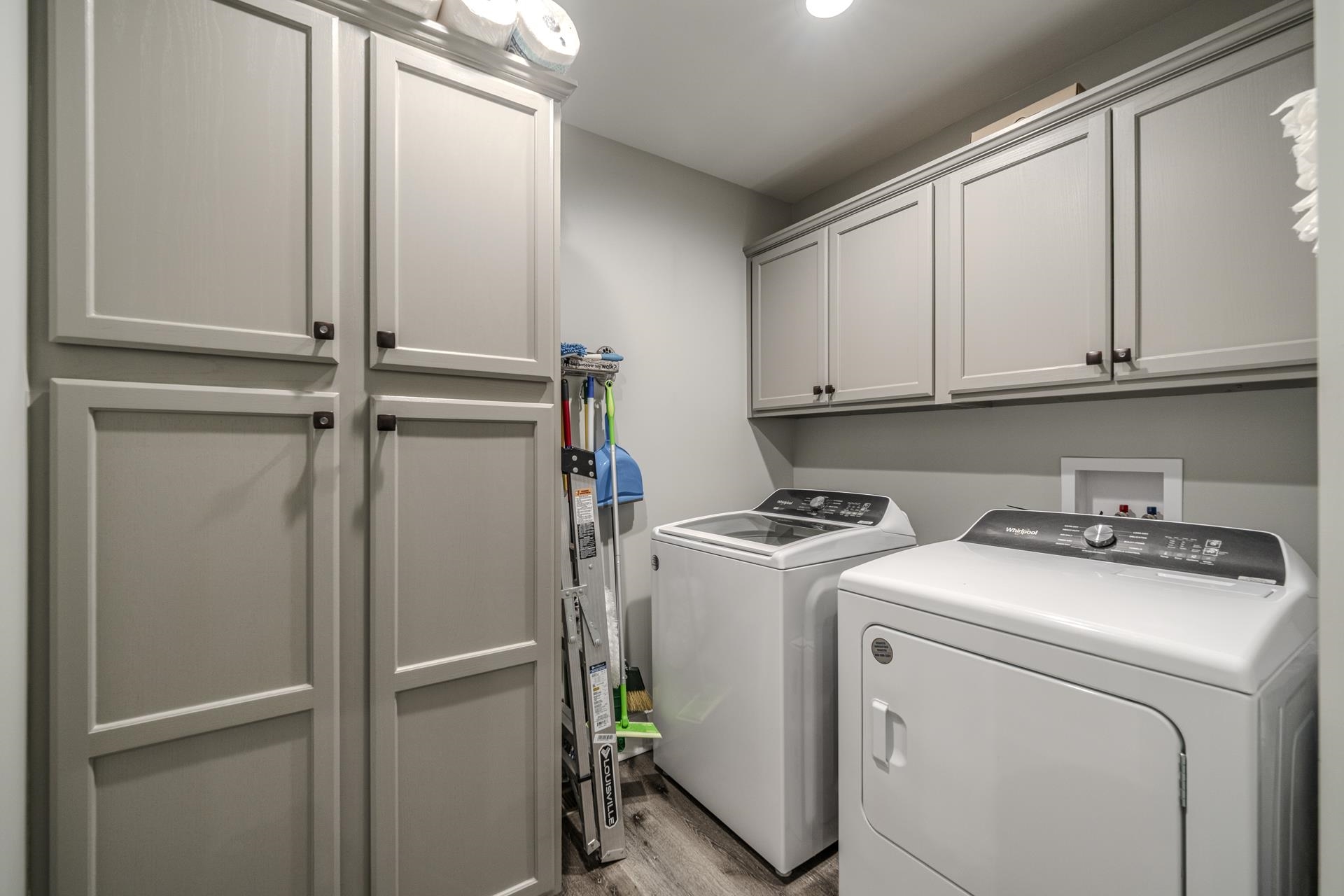 120 Rustic Trail Counce, TN 38326 - Photo 16 of 29 Laundry room with cabinet space, light wood-style floors, and washer and dryer