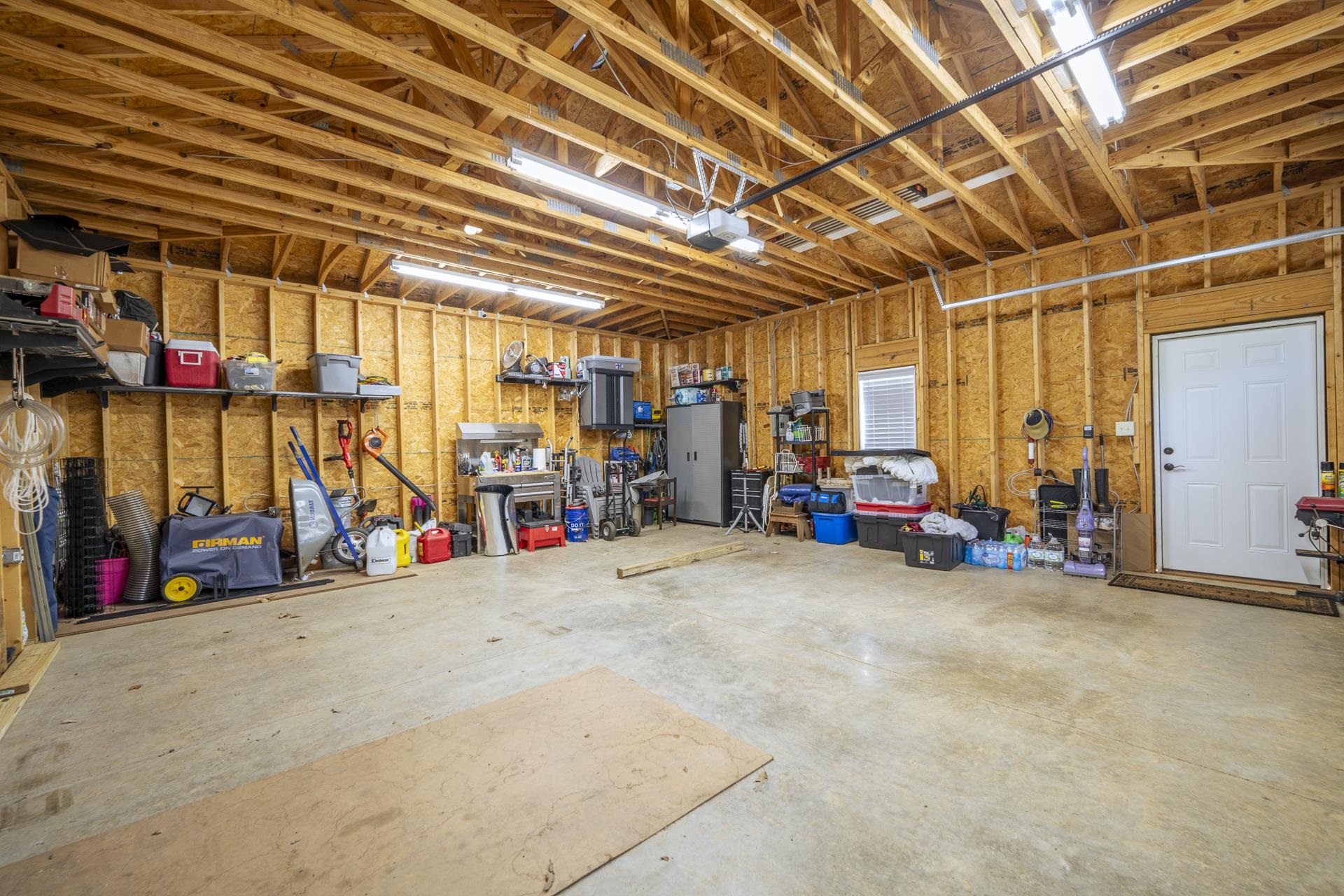 120 Rustic Trail Counce, TN 38326 - Photo 26 of 29 Garage with a workshop area and a garage door opener