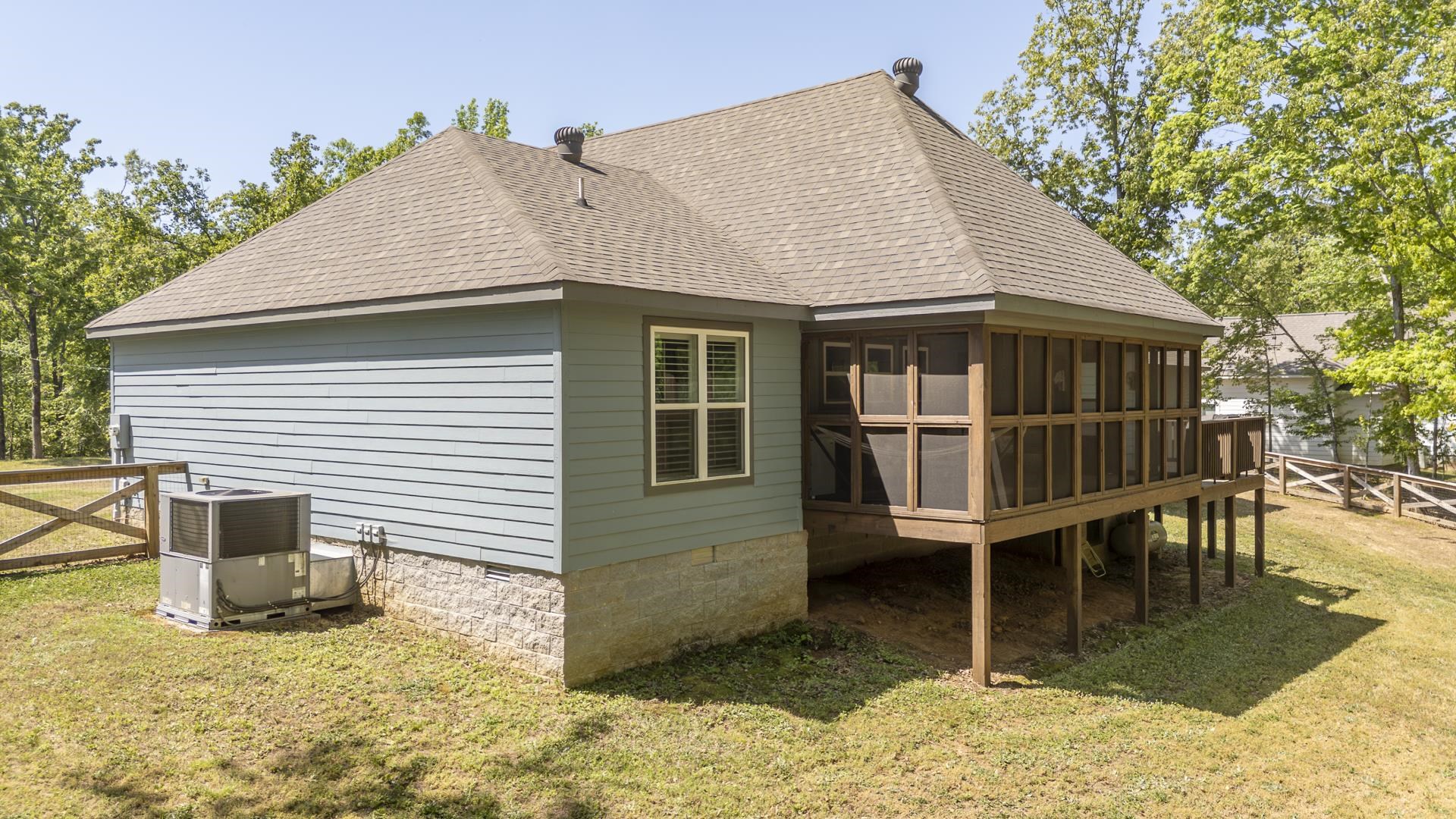 120 Rustic Trail Counce, TN 38326 - Photo 3 of 29 Back of property with a sunroom, a shingled roof, and crawl space