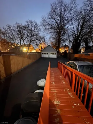 a view of house with wooden deck