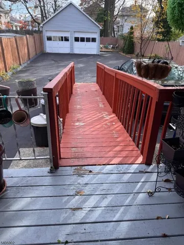 a kitchen with a refrigerator and a stove top oven