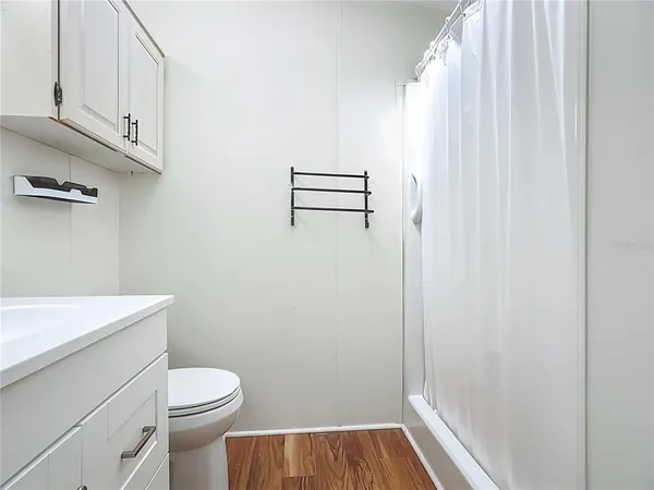 a view of bathroom with a toilet and a window