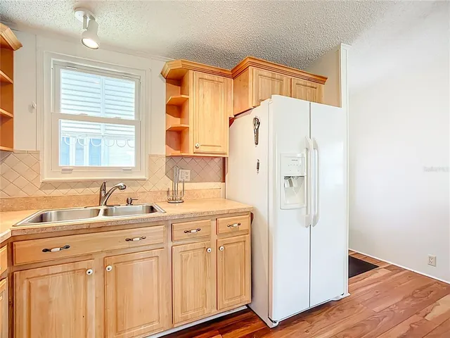 a bathroom with a sink a mirror and a shower