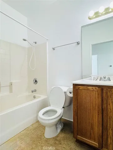 a bathroom with a toilet a sink and a bathtub